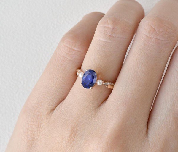 Oval Shaped Sapphire Trinity Twist Ring - Finger